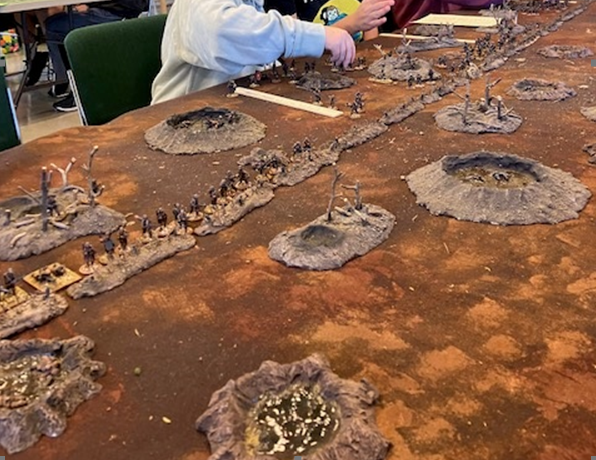 image of wargame with trenches and small soldier figures