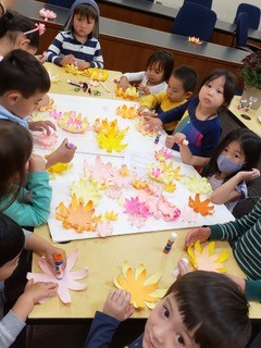 Children making paper flower laterns