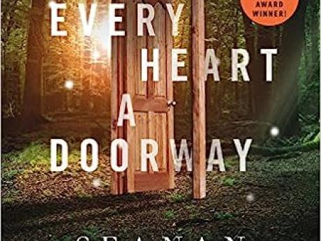 Every heart a doorway cover, an open door in the middle of the woods going nowhere