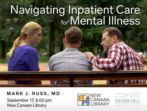 Back view of white mother and father flanking their son with concern