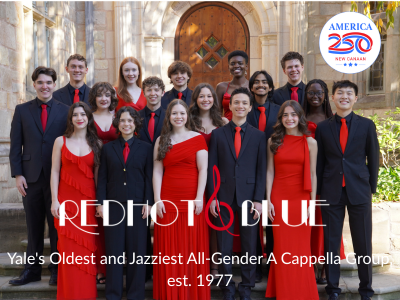 Group of young singers assembled in red and black dresses and suits