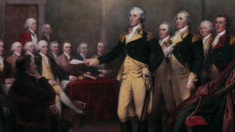George Washington surrounded by other white American politicians and representatives in a formal indoor setting during ratification of the Articles of the Confederation
