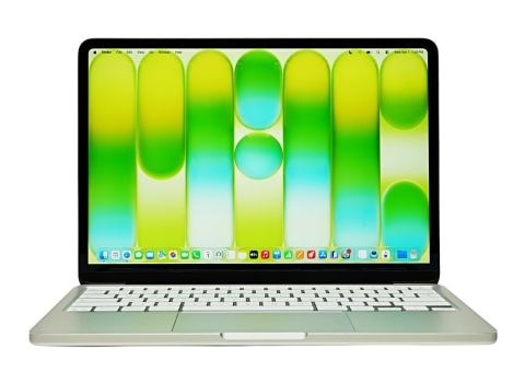 A MacBook Neo with a green screen saver. 