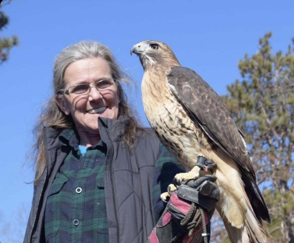 A woman hold a bird 