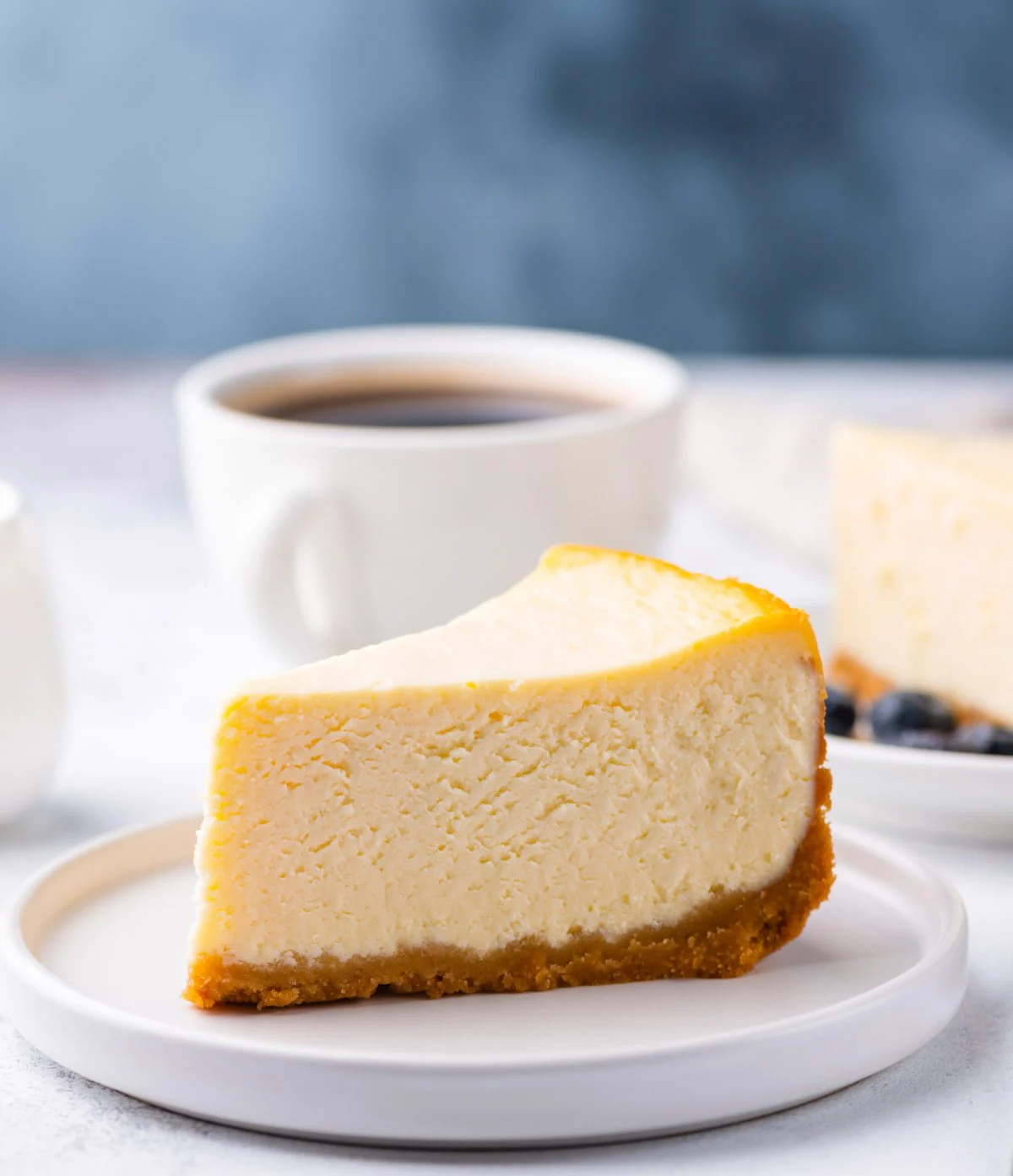 slice of cheesecake and cup of coffee