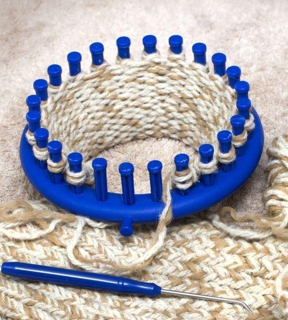 Photograph of a round peg loom and an in progress knitted scarf